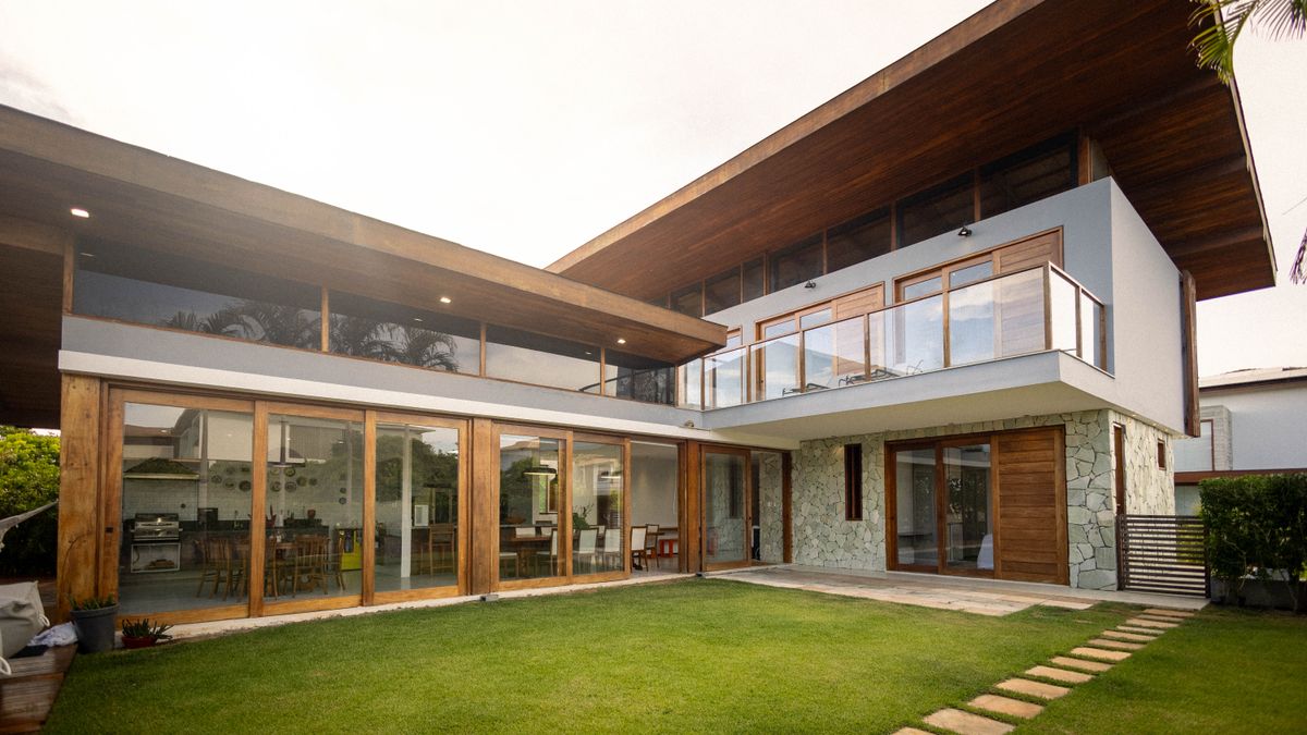 Tropical Florida home with floor-to-ceiling impact glass and sliding doors