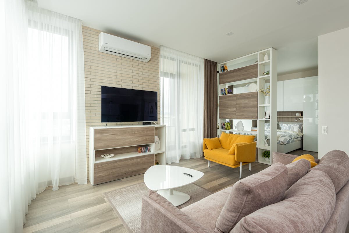 Bright interior with large impact windows and sliding glass doors